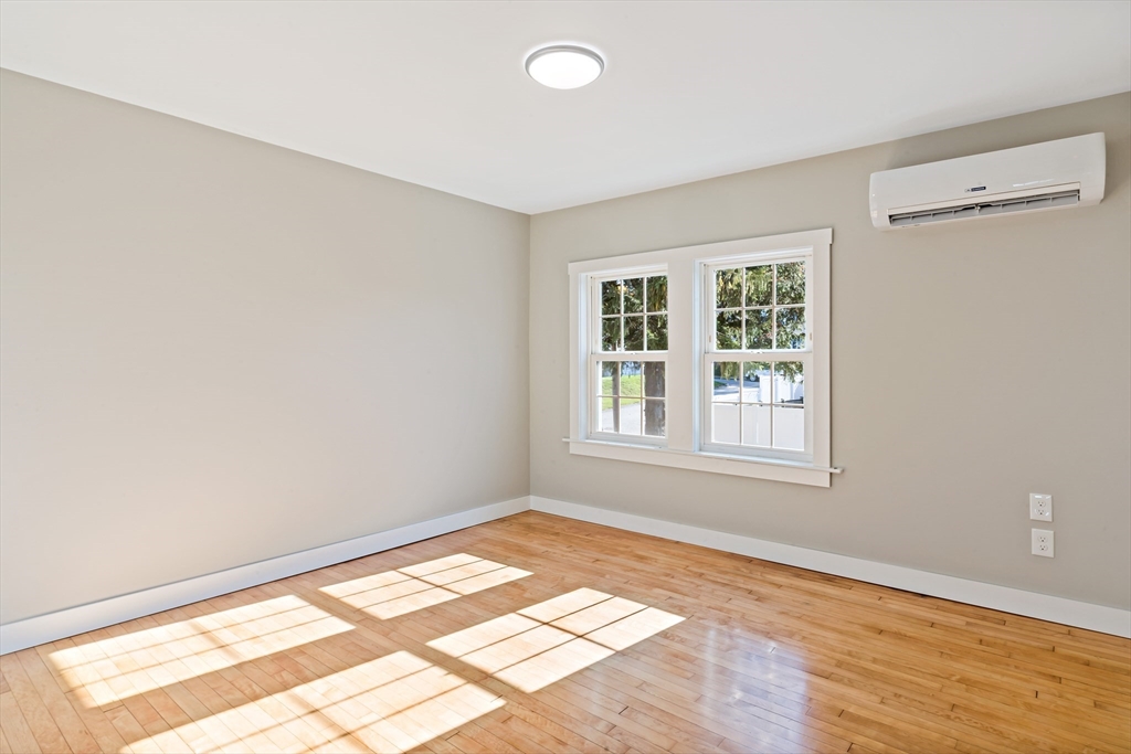 172 Gibbs Street Fall River, MA 02720 - Photo 20 of 29 an empty room with wooden floor and windows