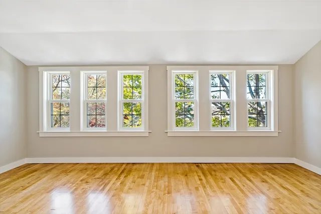 a view of a bedroom with a large window and a bed