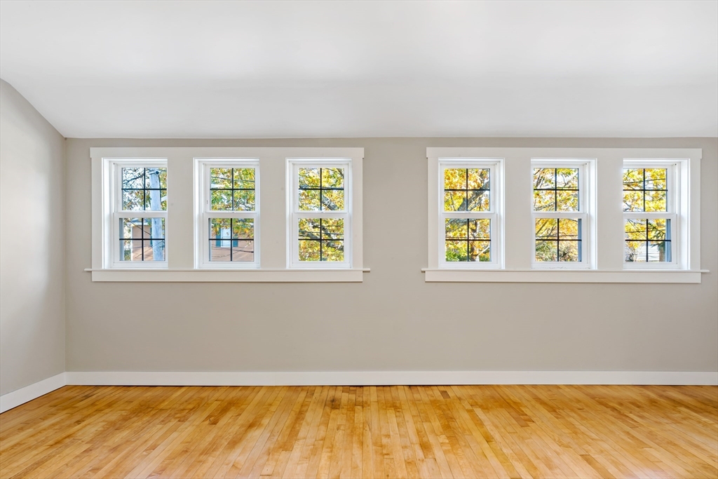 172 Gibbs Street Fall River, MA 02720 - Photo 27 of 29 a view of an empty room with a window and hardwood floor