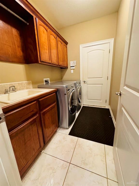 201 Thornwood Loop Rio Grande City, TX 78582 - Photo 24 of 25 a utility room with sink dryer and washer