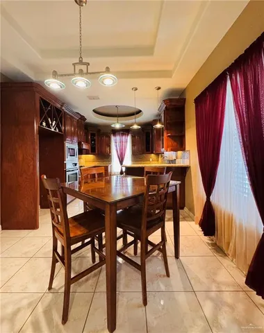 a view of a dining room with furniture