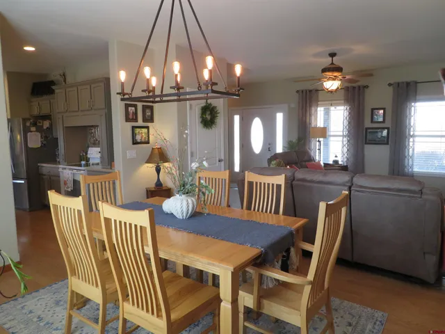 a kitchen with lots of counter top space and dining table