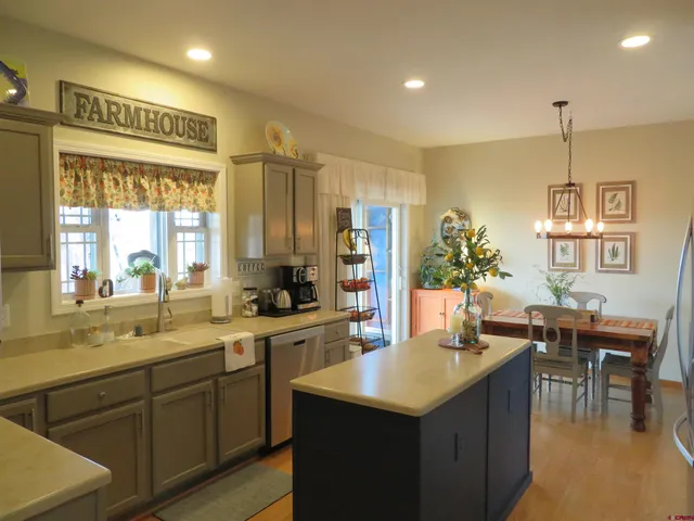 a kitchen with a stove refrigerator and cabinets