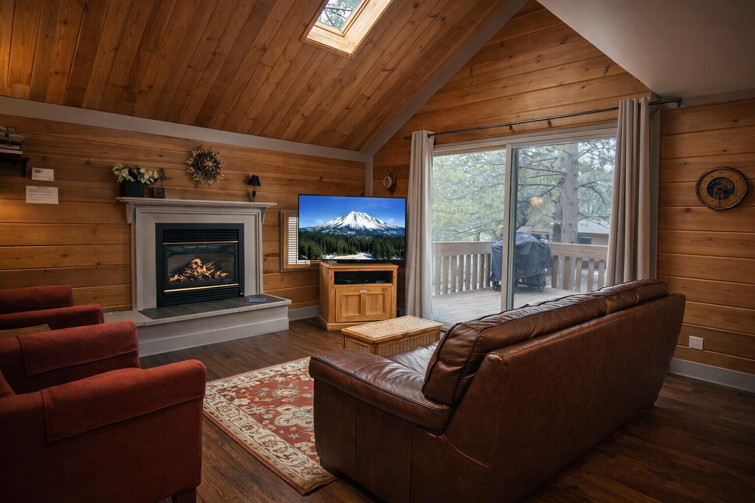 57397 Overlook Road Sunriver, OR 97707 - Photo 2 of 23 Large glass door invite natural light into this cozy gathering space.