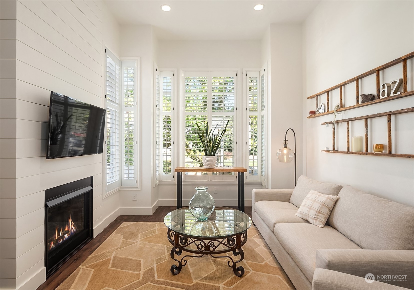 4401 Brygger Drive West Seattle, WA 98199 - Photo 11 of 36 a living room with furniture fireplace and window