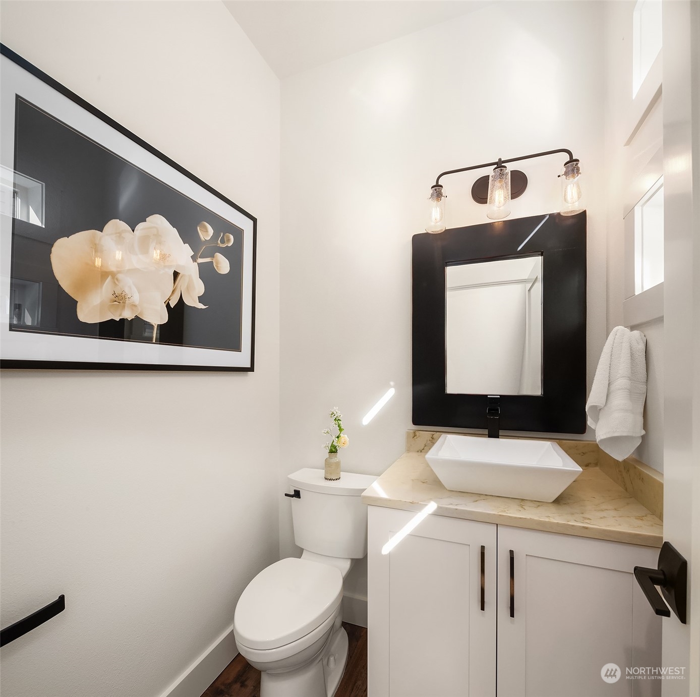 4401 Brygger Drive West Seattle, WA 98199 - Photo 15 of 36 a bathroom with a toilet a sink and mirror