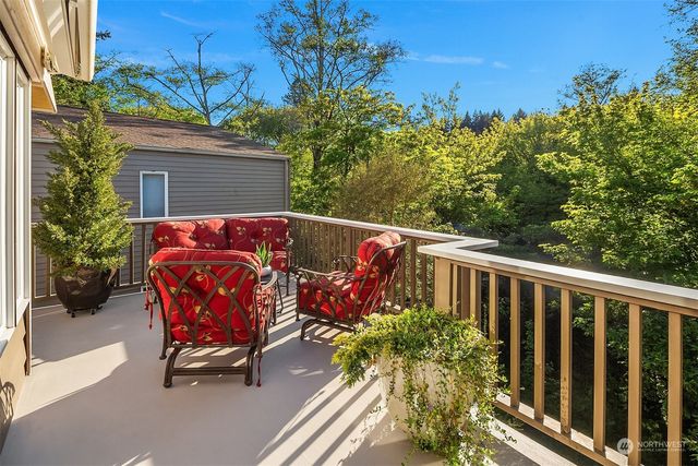 a view of an outdoor sitting area with furniture