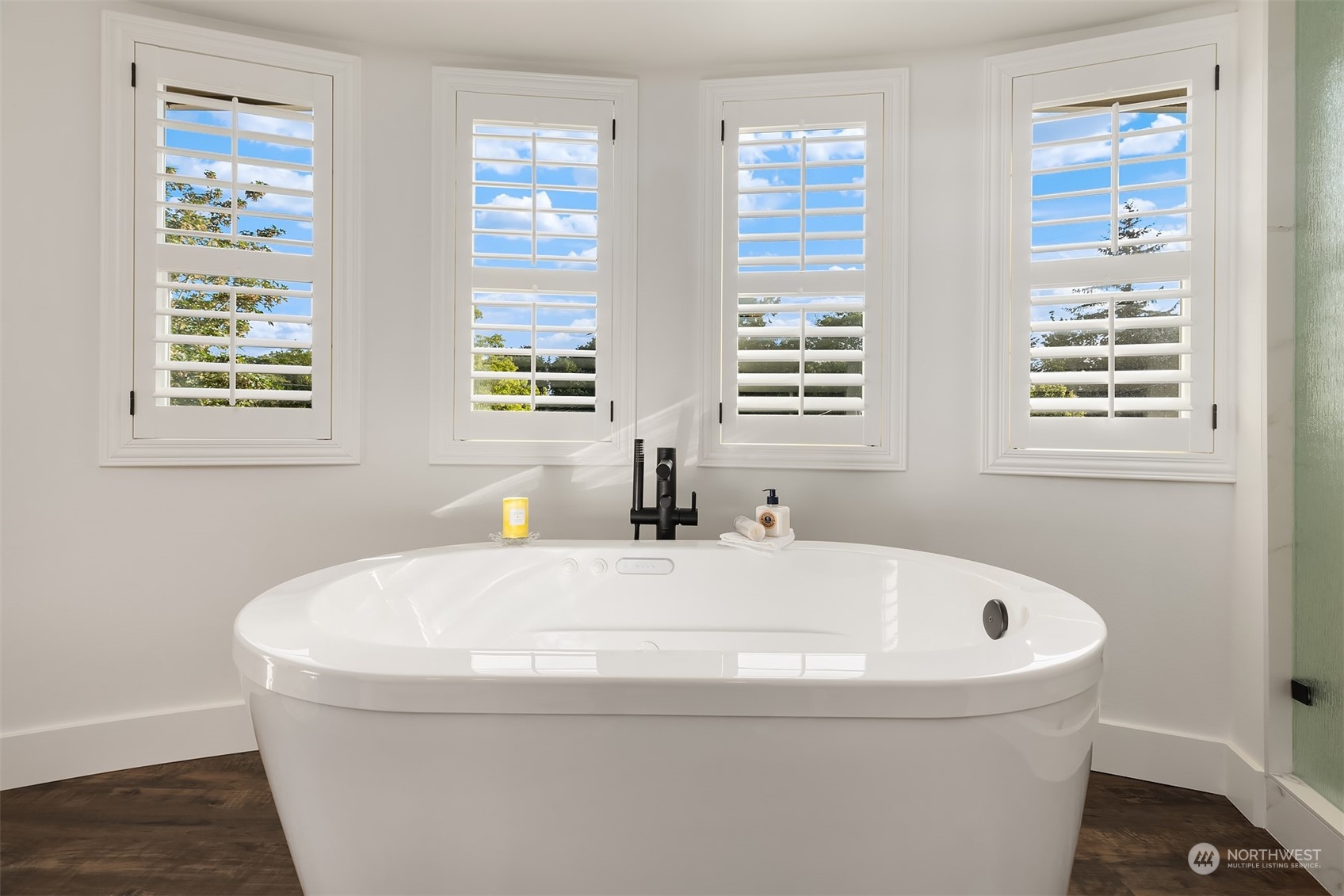 4401 Brygger Drive West Seattle, WA 98199 - Photo 20 of 36 a white bath tub sitting in a bathroom next to a window