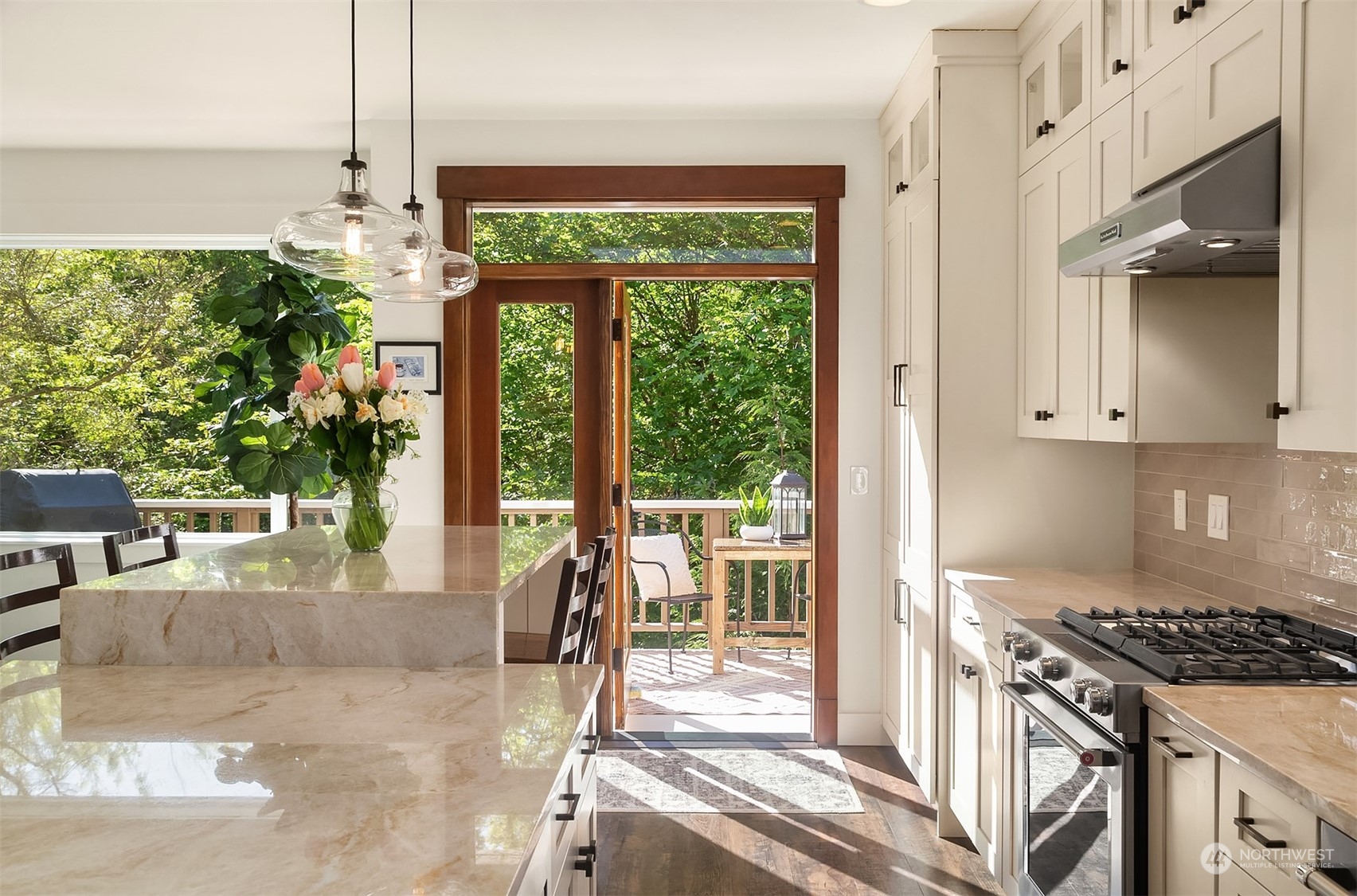 4401 Brygger Drive West Seattle, WA 98199 - Photo 3 of 36 a kitchen with table chairs and large window
