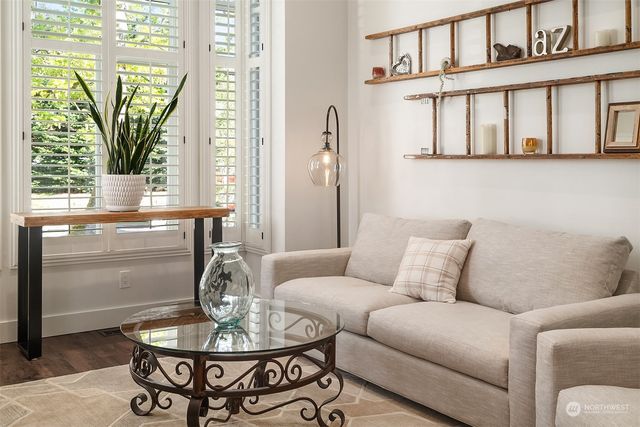a living room with furniture and a table