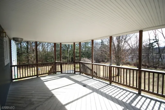 a view of a balcony with wooden floor