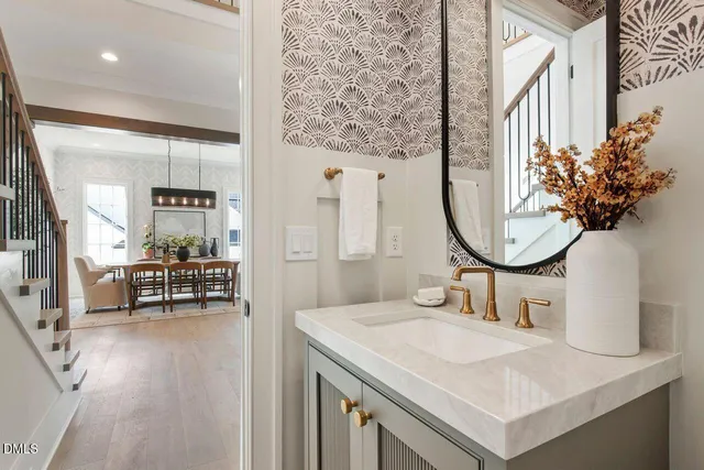 an aerial view of a house with a yard and fountain