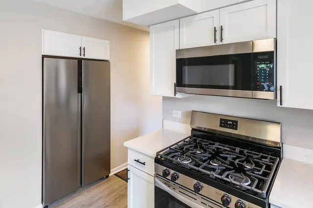 a kitchen with a stove and a microwave