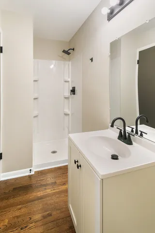 a bathroom with a sink and a mirror