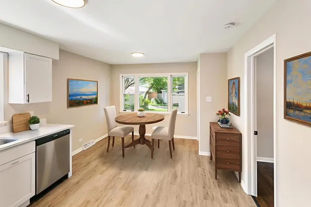 a view of a livingroom with furniture window and wooden floor
