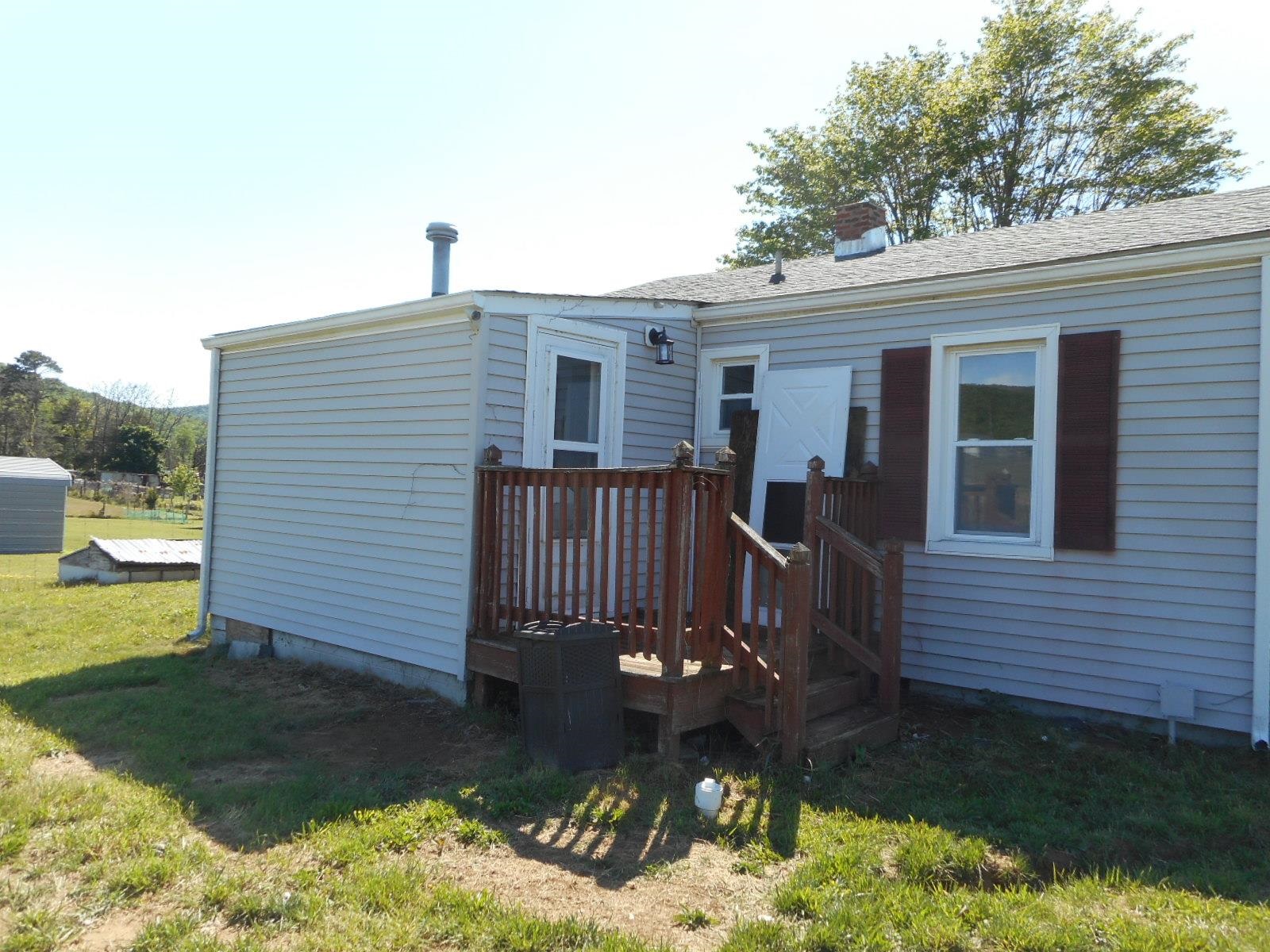 18874 Huckleberry Road Elkton, VA 22827 - Photo 4 of 23 a front view of a house with garden