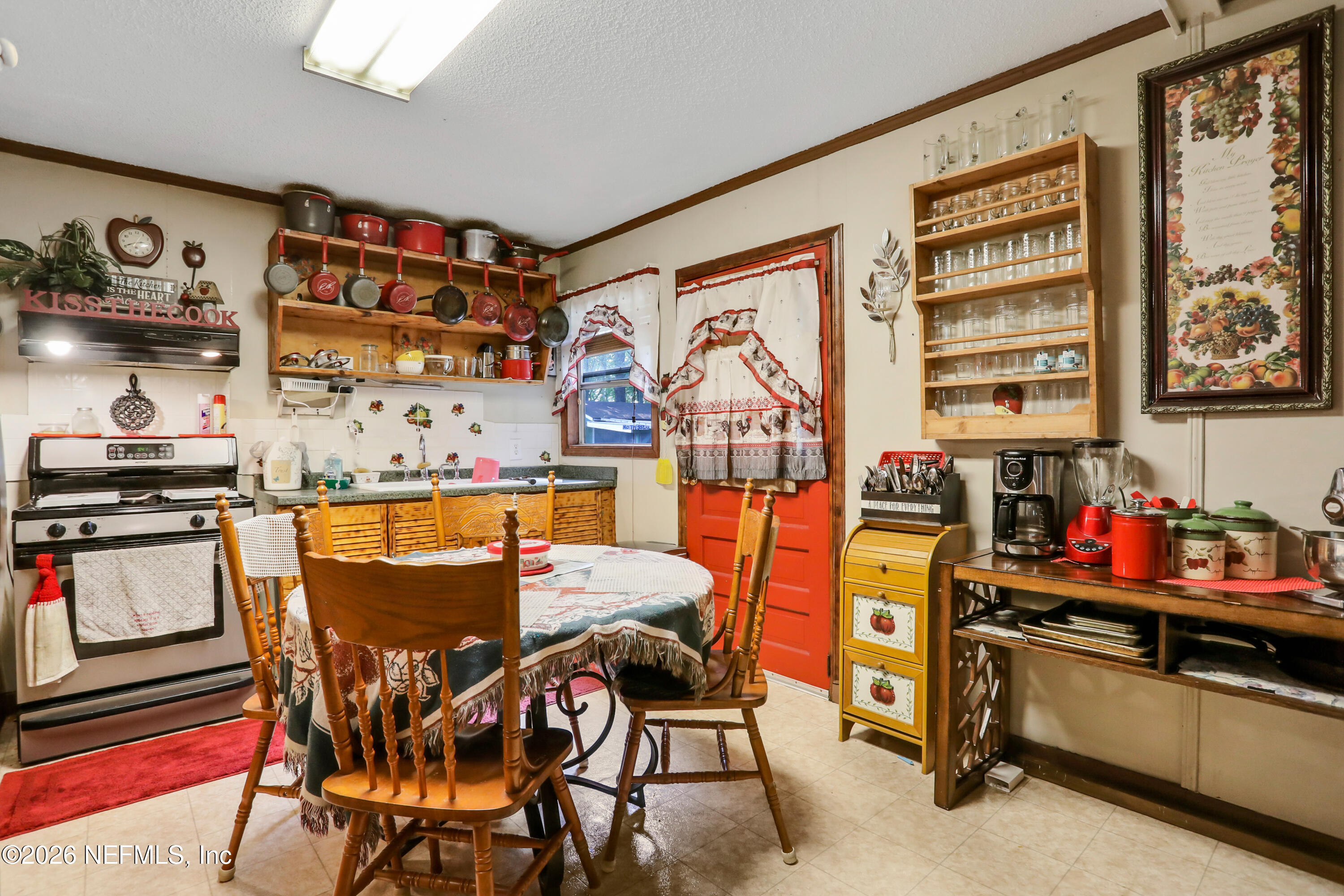 1702 Balboa Lane Middleburg, FL 32068 - Photo 11 of 31 a dining area with furniture and a kitchen view