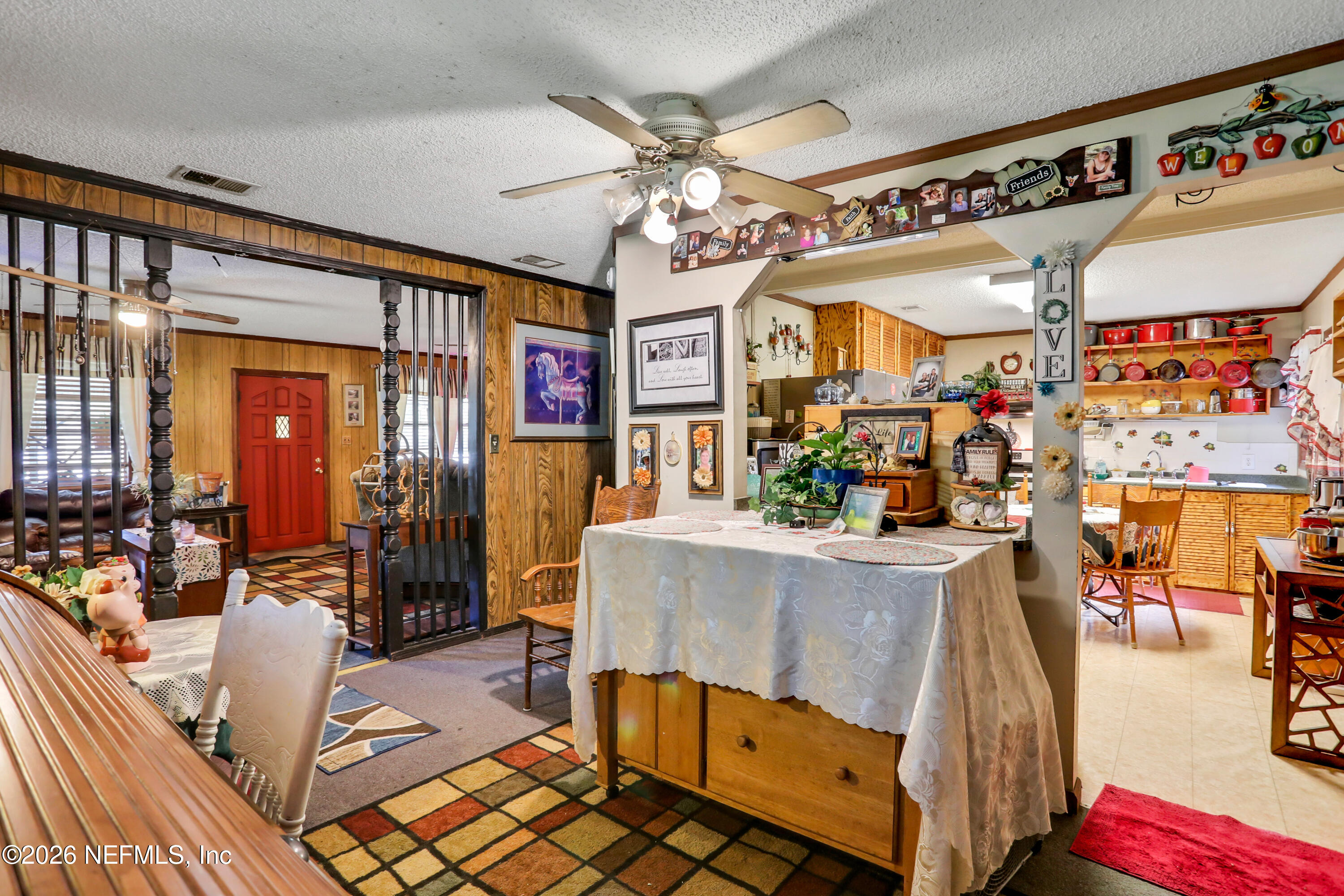1702 Balboa Lane Middleburg, FL 32068 - Photo 13 of 31 a living room with furniture and a chandelier