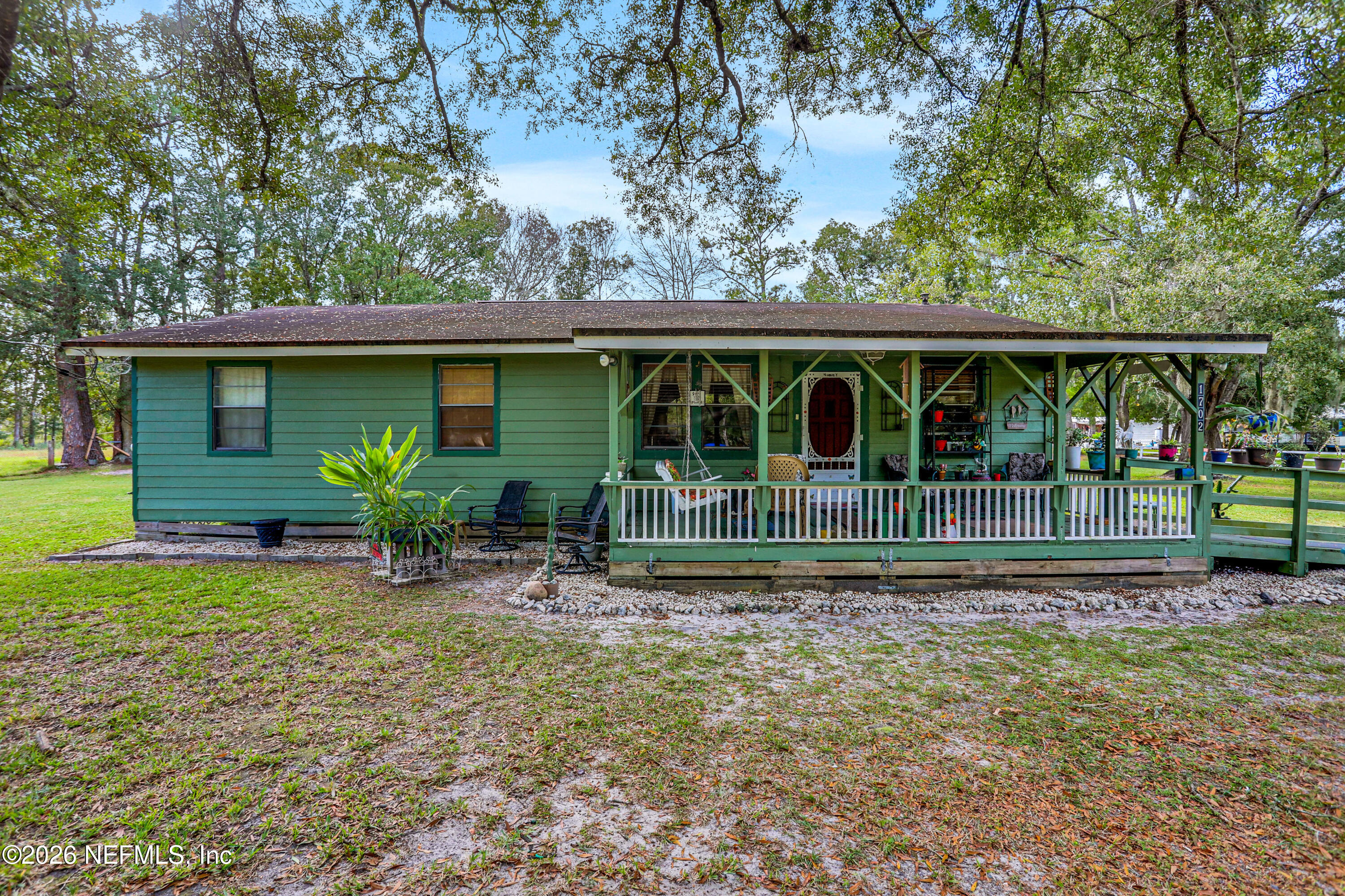1702 Balboa Lane Middleburg, FL 32068 - Photo 14 of 31 a view of a house with backyard and porch