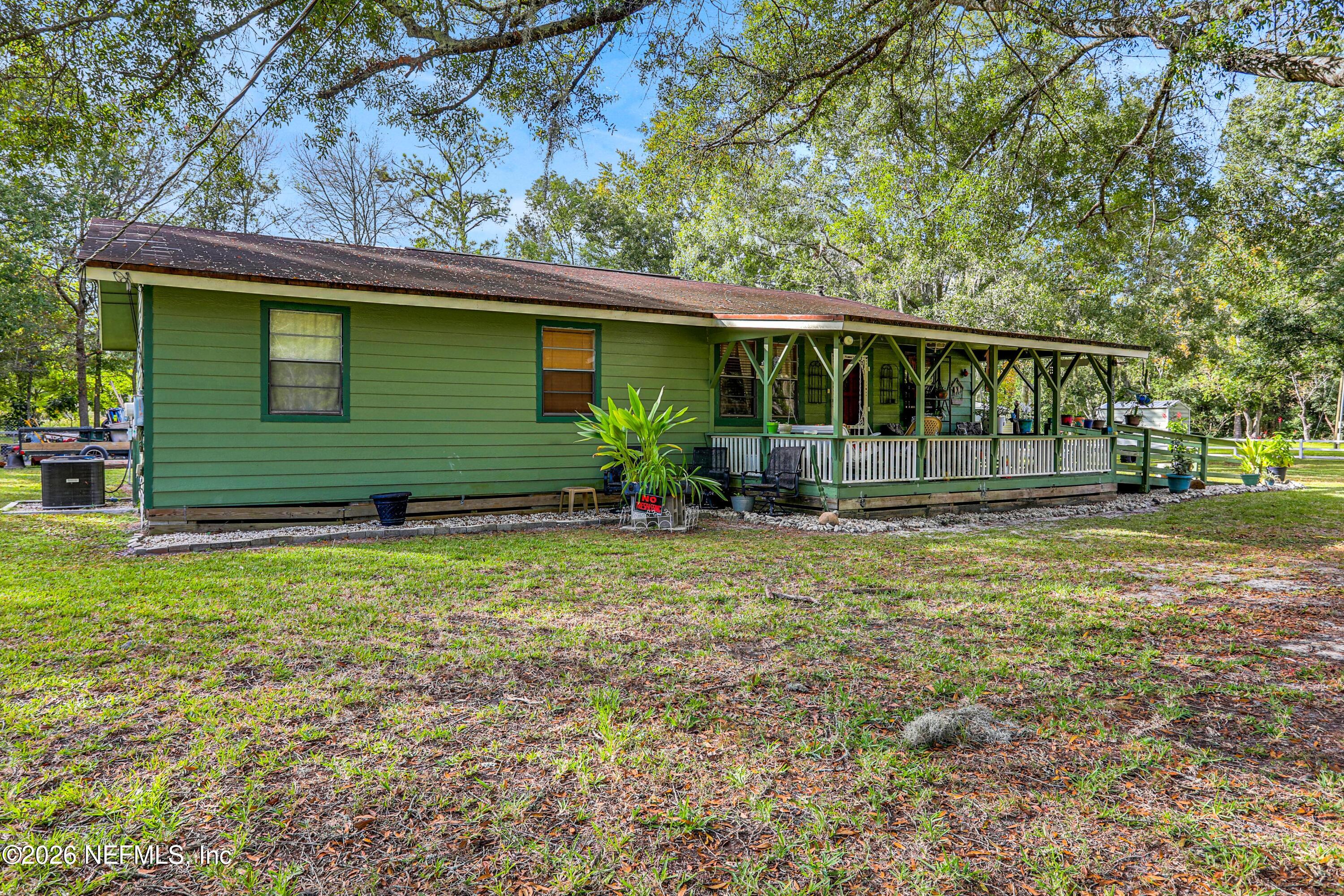 1702 Balboa Lane Middleburg, FL 32068 - Photo 15 of 31 a front view of a house with garden