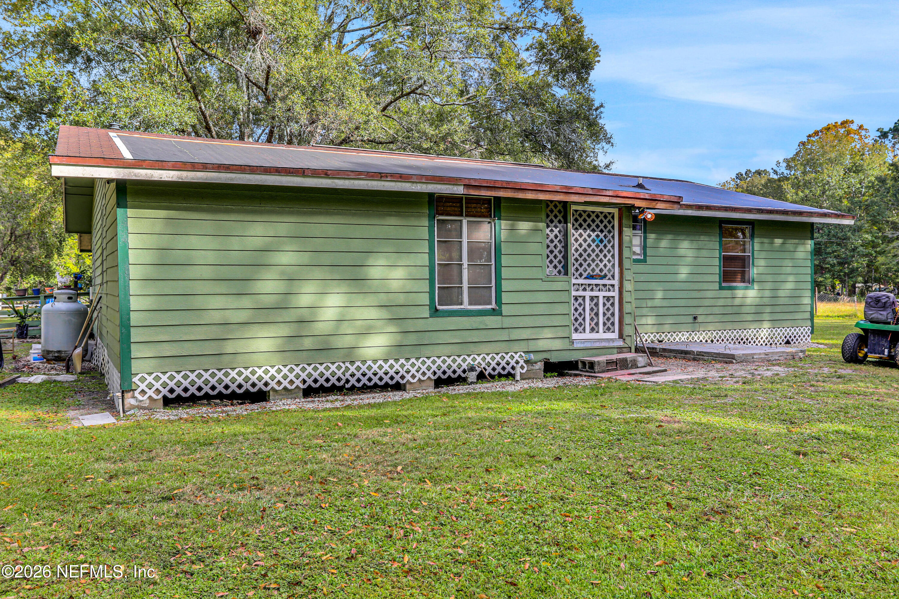 1702 Balboa Lane Middleburg, FL 32068 - Photo 18 of 31 a view of a house with a yard