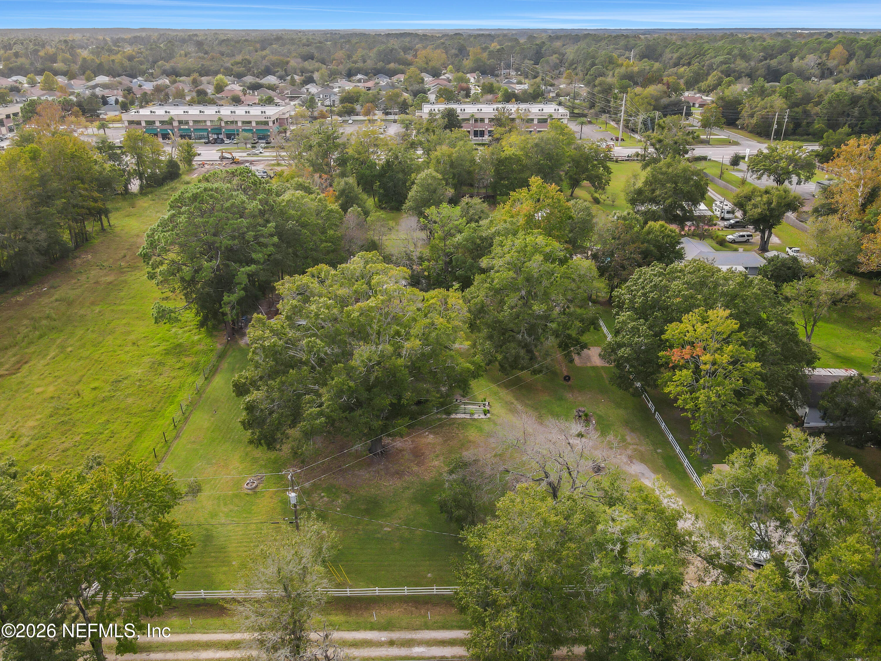 1702 Balboa Lane Middleburg, FL 32068 - Photo 25 of 31 an aerial view of residential houses with outdoor space and trees