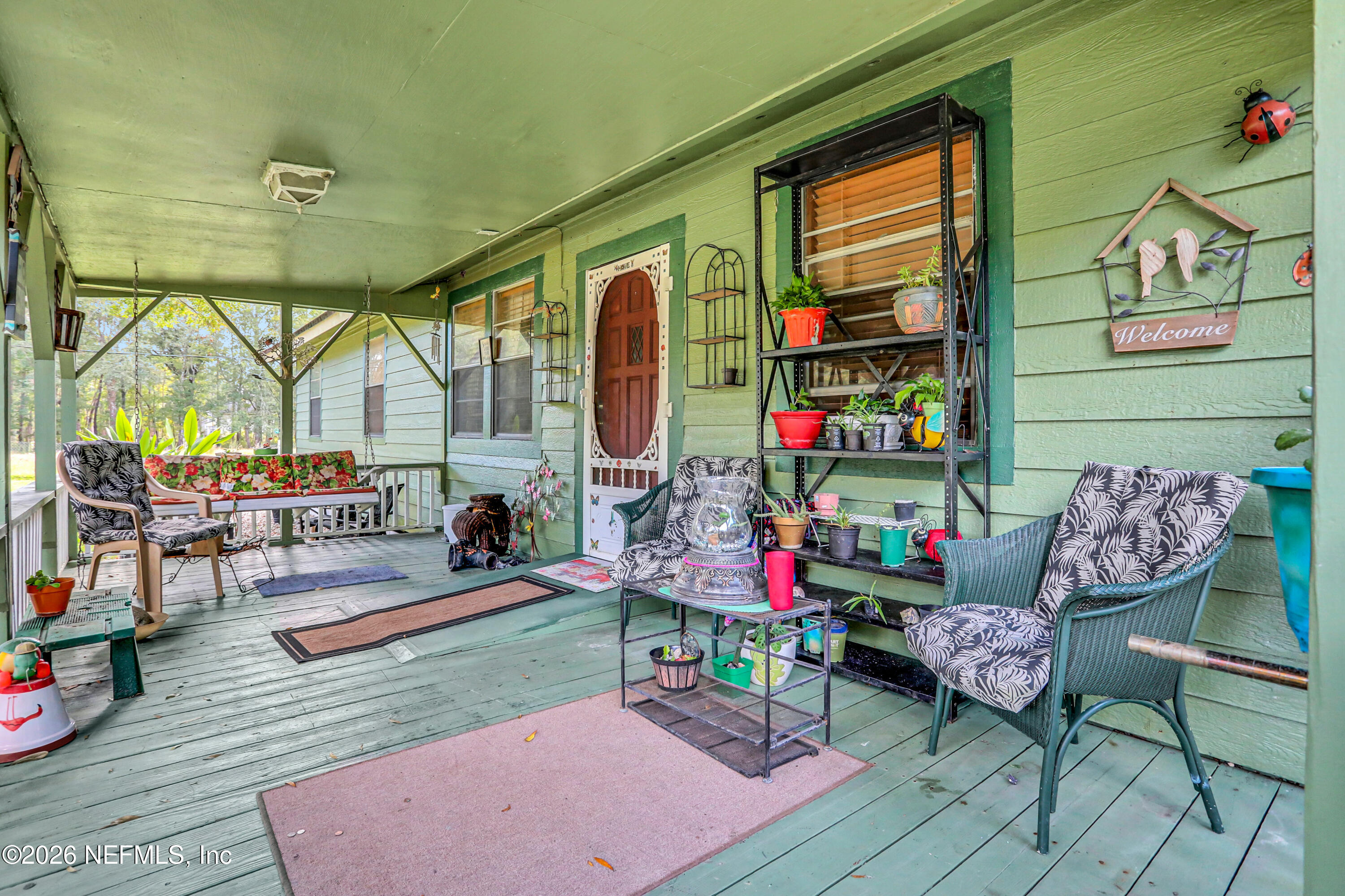 1702 Balboa Lane Middleburg, FL 32068 - Photo 3 of 31 a outdoor living space with furniture and a potted plant