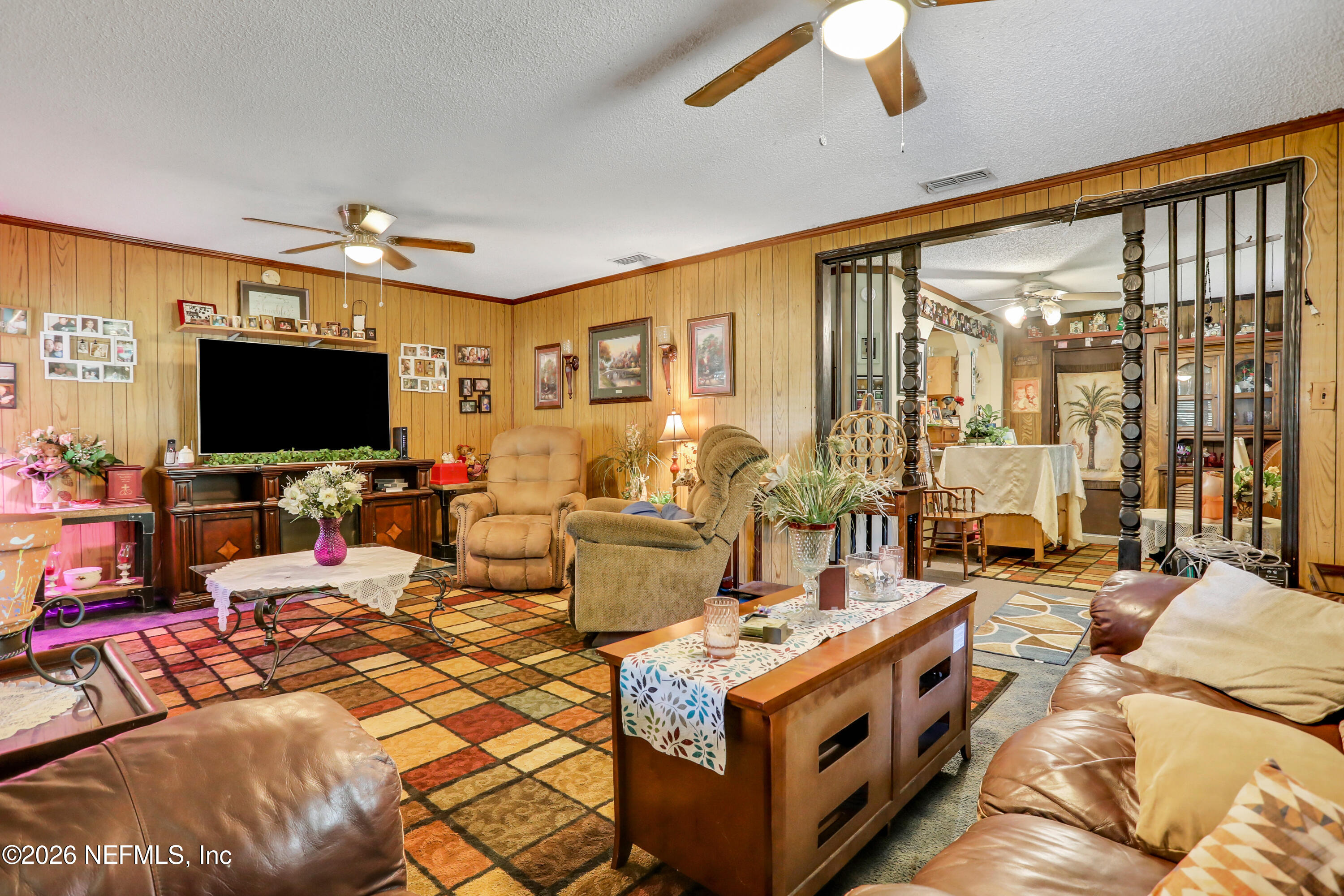 1702 Balboa Lane Middleburg, FL 32068 - Photo 6 of 31 a living room with patio furniture and a flat screen tv