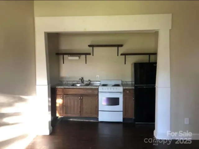 a kitchen with stainless steel appliances a stove and a refrigerator