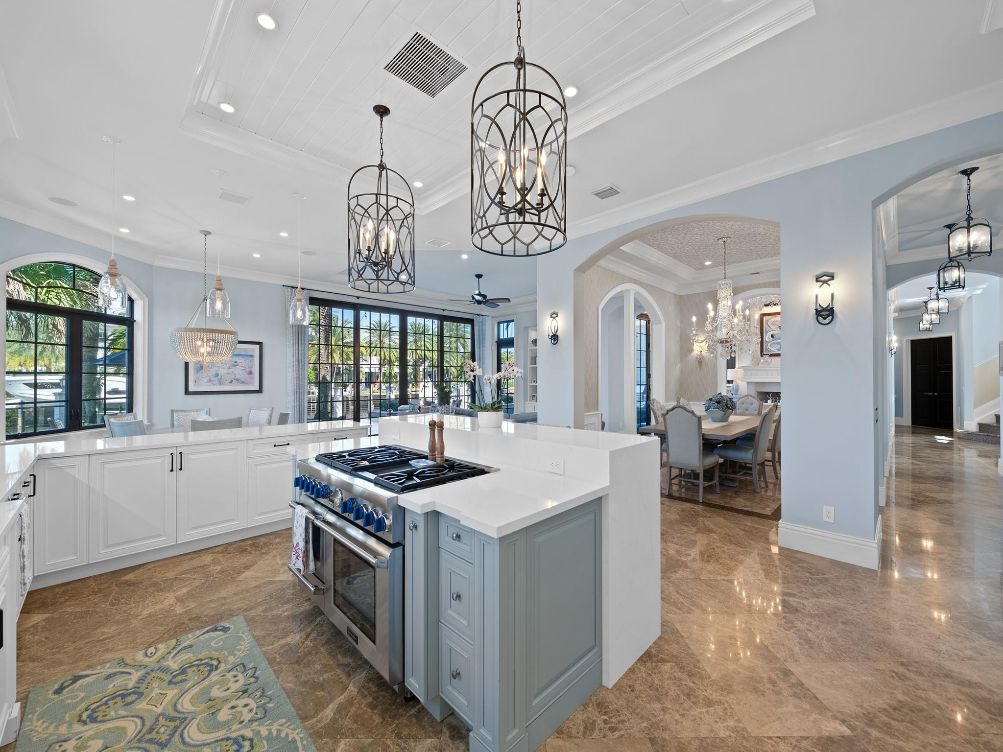 2319 Northeast 28th Street Lighthouse Point, FL 33064 - Photo 14 of 59 a kitchen that has a lot of cabinets in it