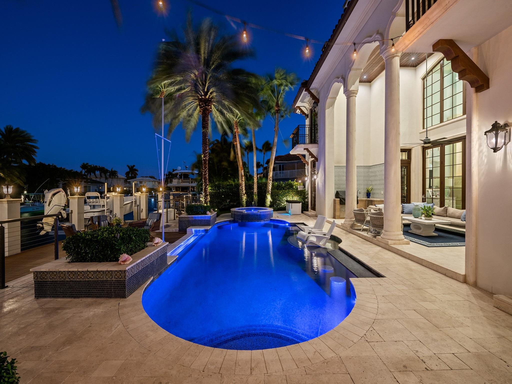 2319 Northeast 28th Street Lighthouse Point, FL 33064 - Photo 19 of 59 a view of a swimming pool with sitting area