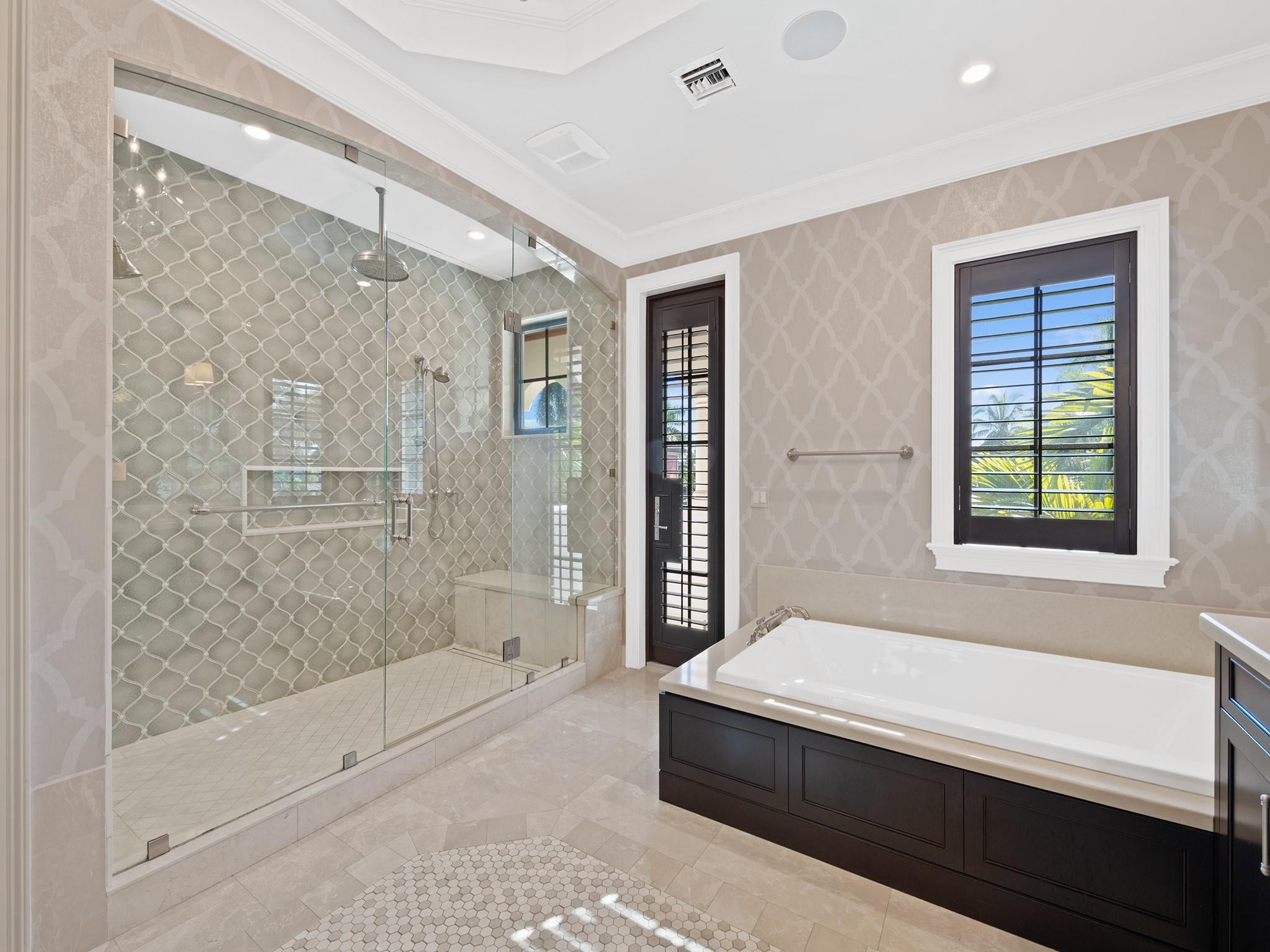 2319 Northeast 28th Street Lighthouse Point, FL 33064 - Photo 32 of 59 a bathroom with a bathtub and a shower