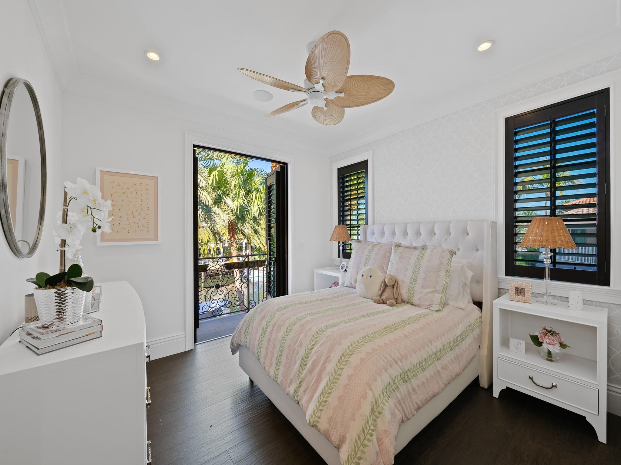 2319 Northeast 28th Street Lighthouse Point, FL 33064 - Photo 37 of 59 a bedroom with a bed and a flat tv screen on dresser