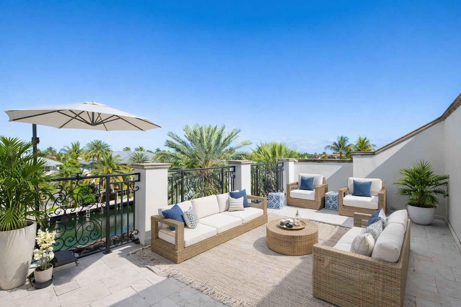 2319 Northeast 28th Street Lighthouse Point, FL 33064 - Photo 46 of 59 a outdoor space with patio the couches and a potted plant