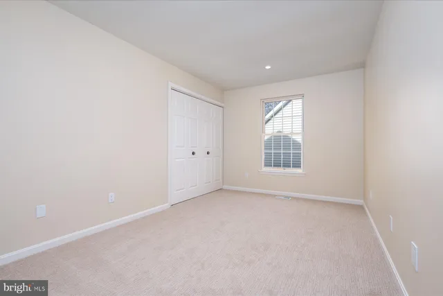a view of a hallway with washer and dryer