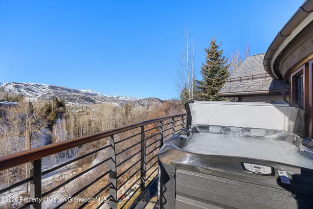 a spacious bedroom with a bed and a couch