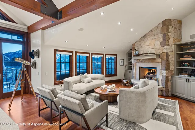 a bedroom with a large bed and a flat screen tv