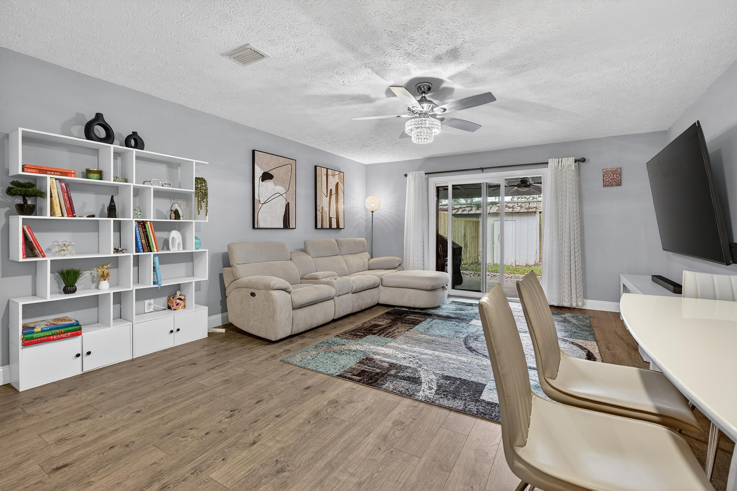 35 10th Street, Unit D Shalimar, FL 32579 - Photo 16 of 33 a living room with furniture and a flat screen tv