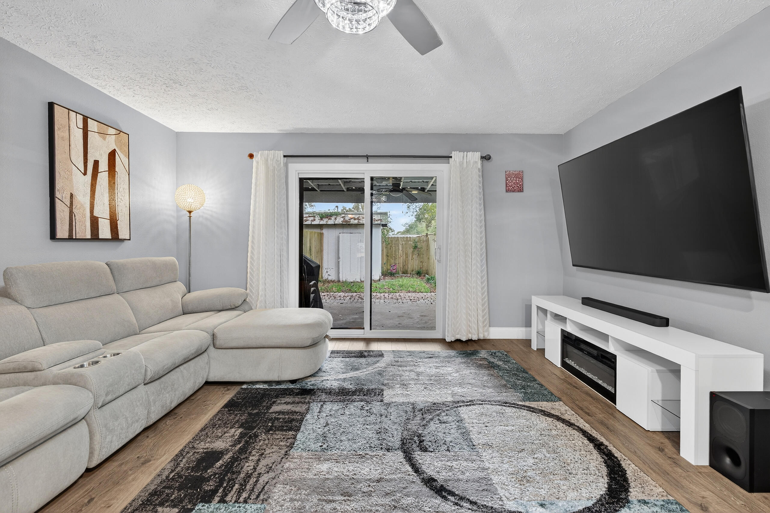35 10th Street, Unit D Shalimar, FL 32579 - Photo 17 of 33 a living room with furniture and a flat screen tv