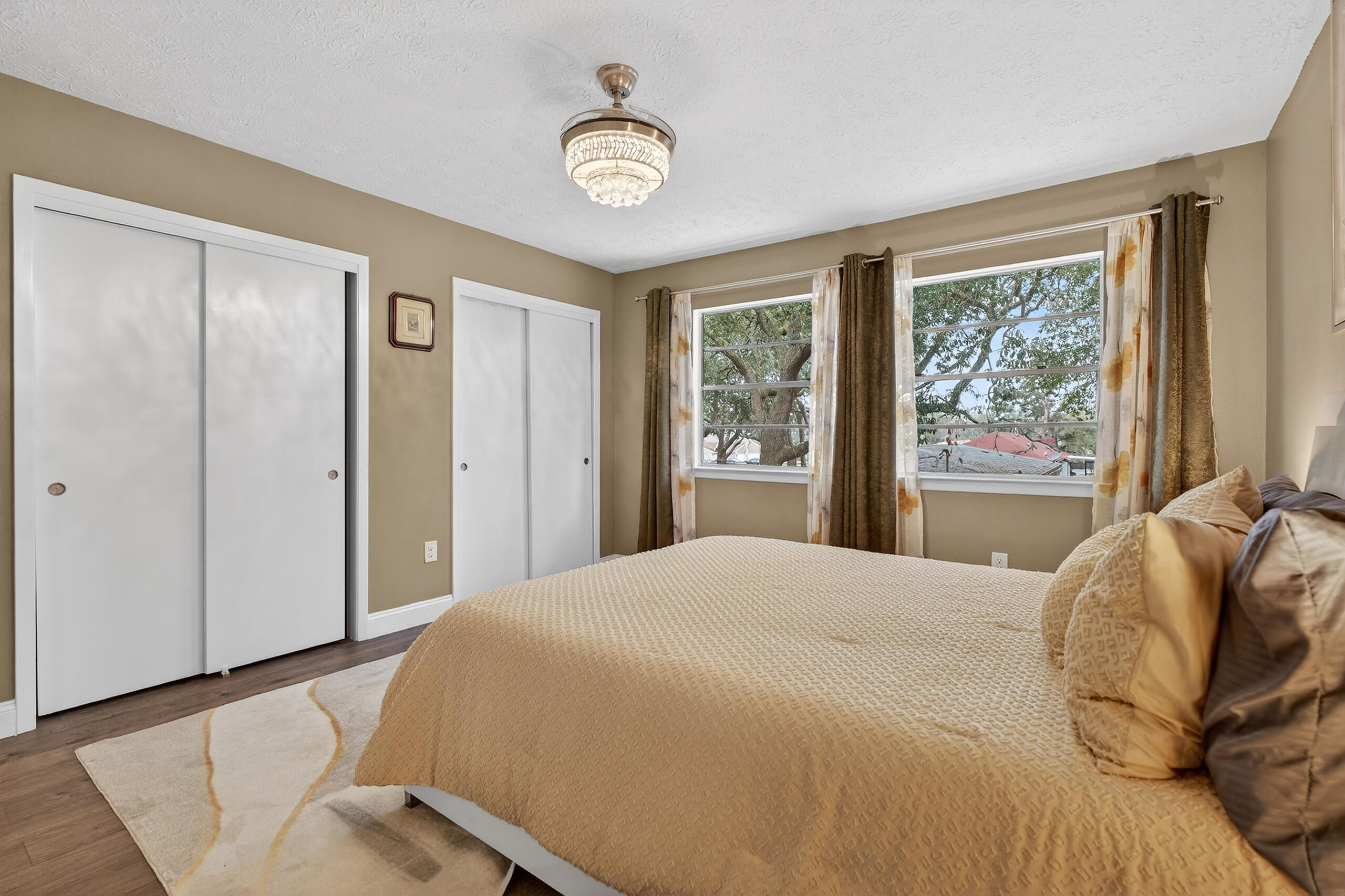 35 10th Street, Unit D Shalimar, FL 32579 - Photo 32 of 33 a bedroom with a large bed and a window