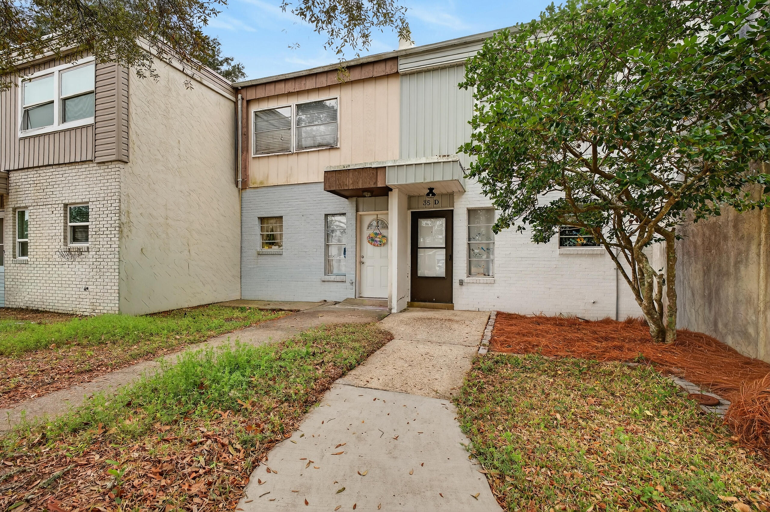 35 10th Street, Unit D Shalimar, FL 32579 - Photo 6 of 33 a view of a backyard with large trees