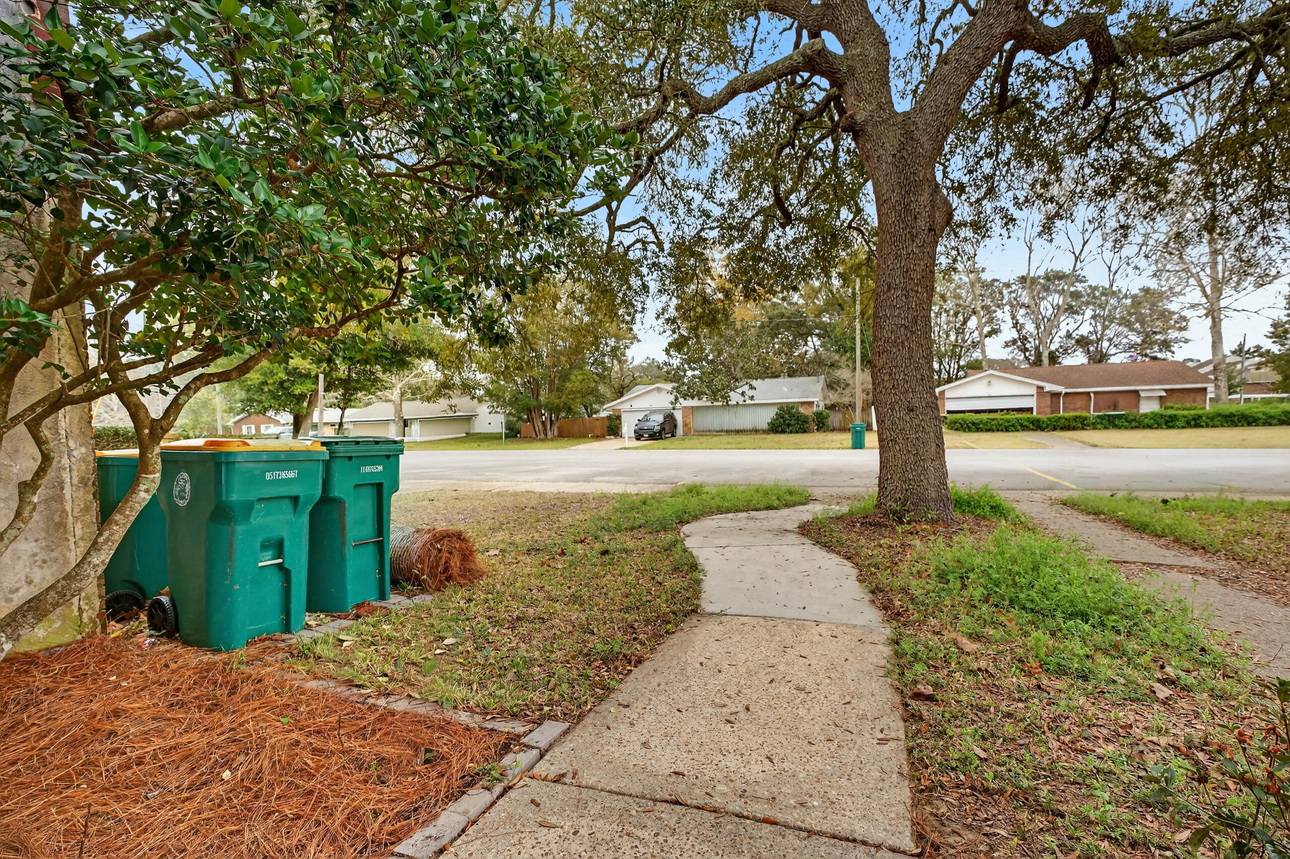 35 10th Street, Unit D Shalimar, FL 32579 - Photo 7 of 33 a view of a yard with plants and trees