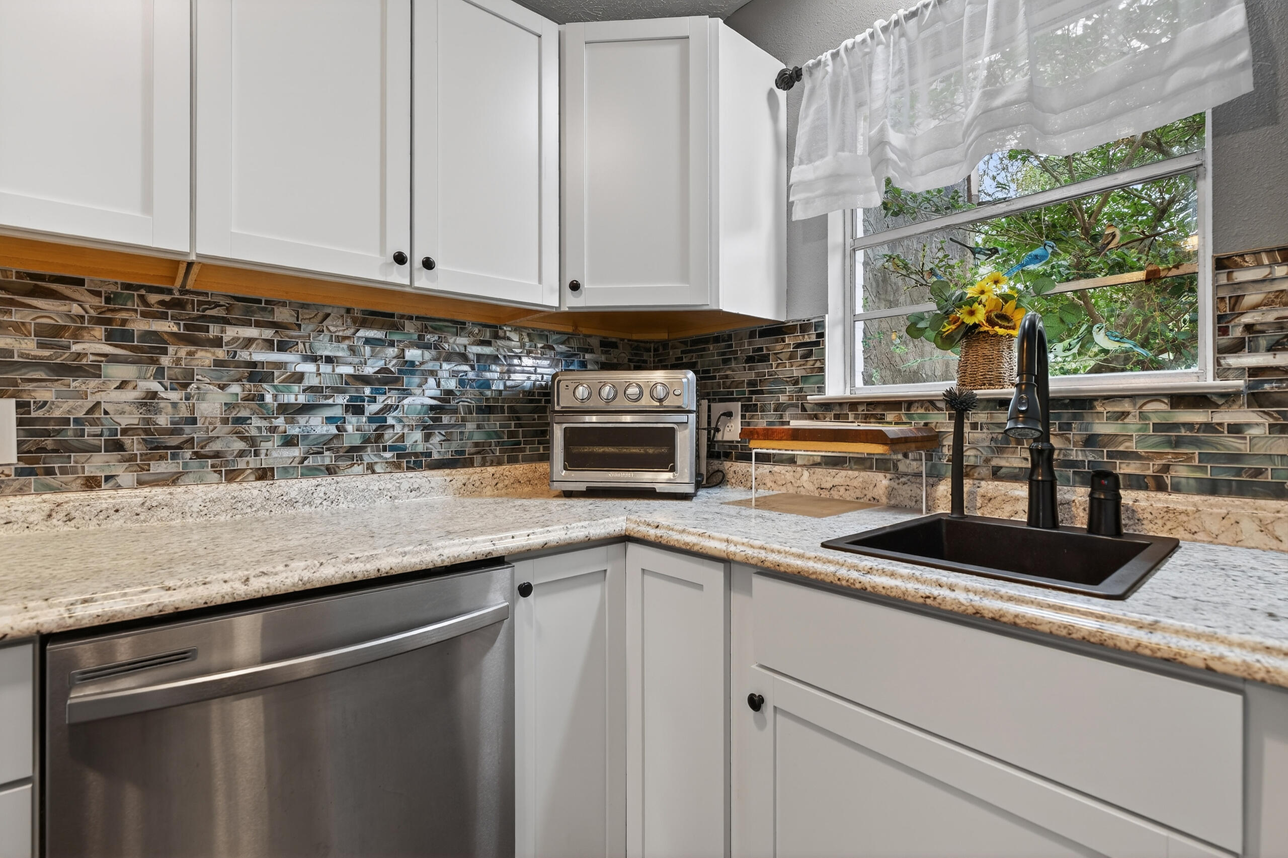 35 10th Street, Unit D Shalimar, FL 32579 - Photo 10 of 33 a kitchen with a sink and cabinets