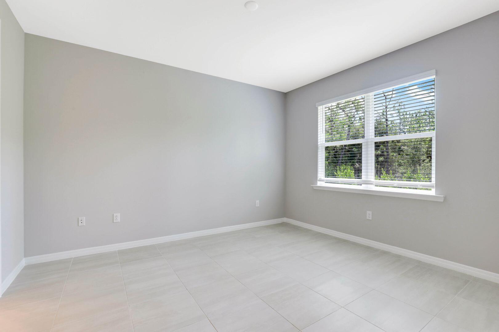 1212 Enbrook Loop Naples, FL 34114 - Photo 23 of 45 an empty room with a window