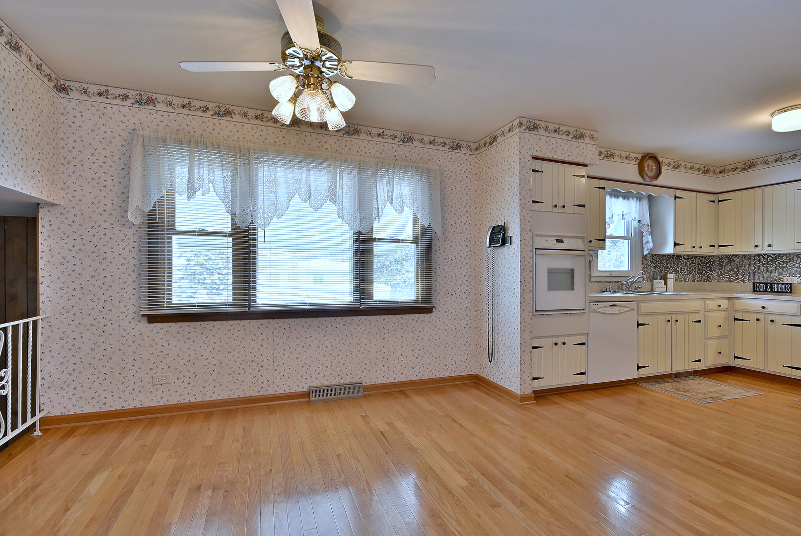 231 North Flora Parkway Addison, IL 60101 - Photo 7 of 39 a kitchen with a wooden floor window and cabinets