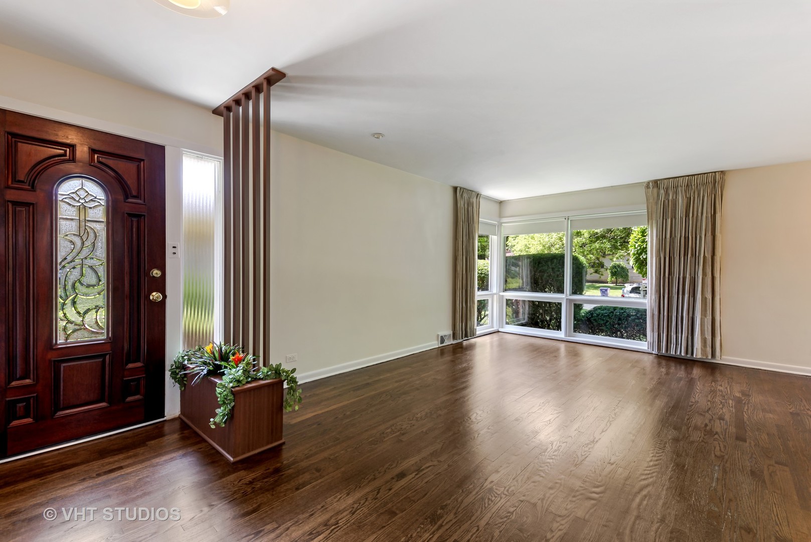 465 Sumac Road Highland Park, IL 60035 - Photo 2 of 19 a view of an empty room with window and wooden floor