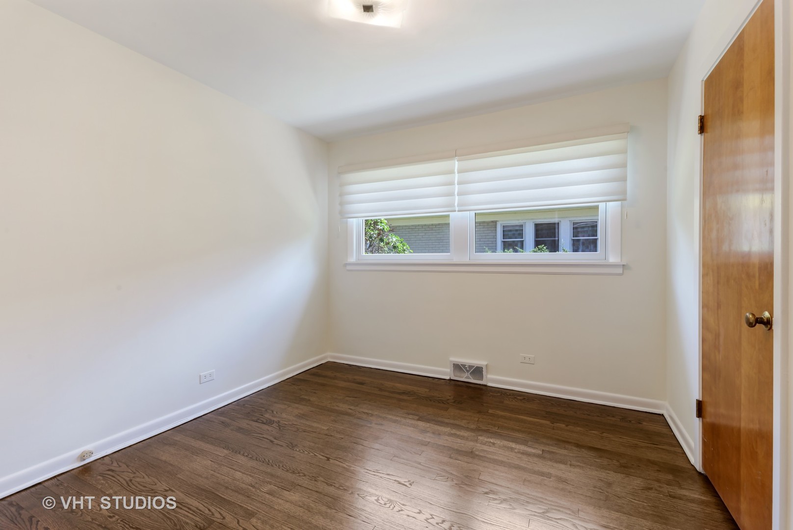 465 Sumac Road Highland Park, IL 60035 - Photo 11 of 19 an empty room with wooden floor and windows