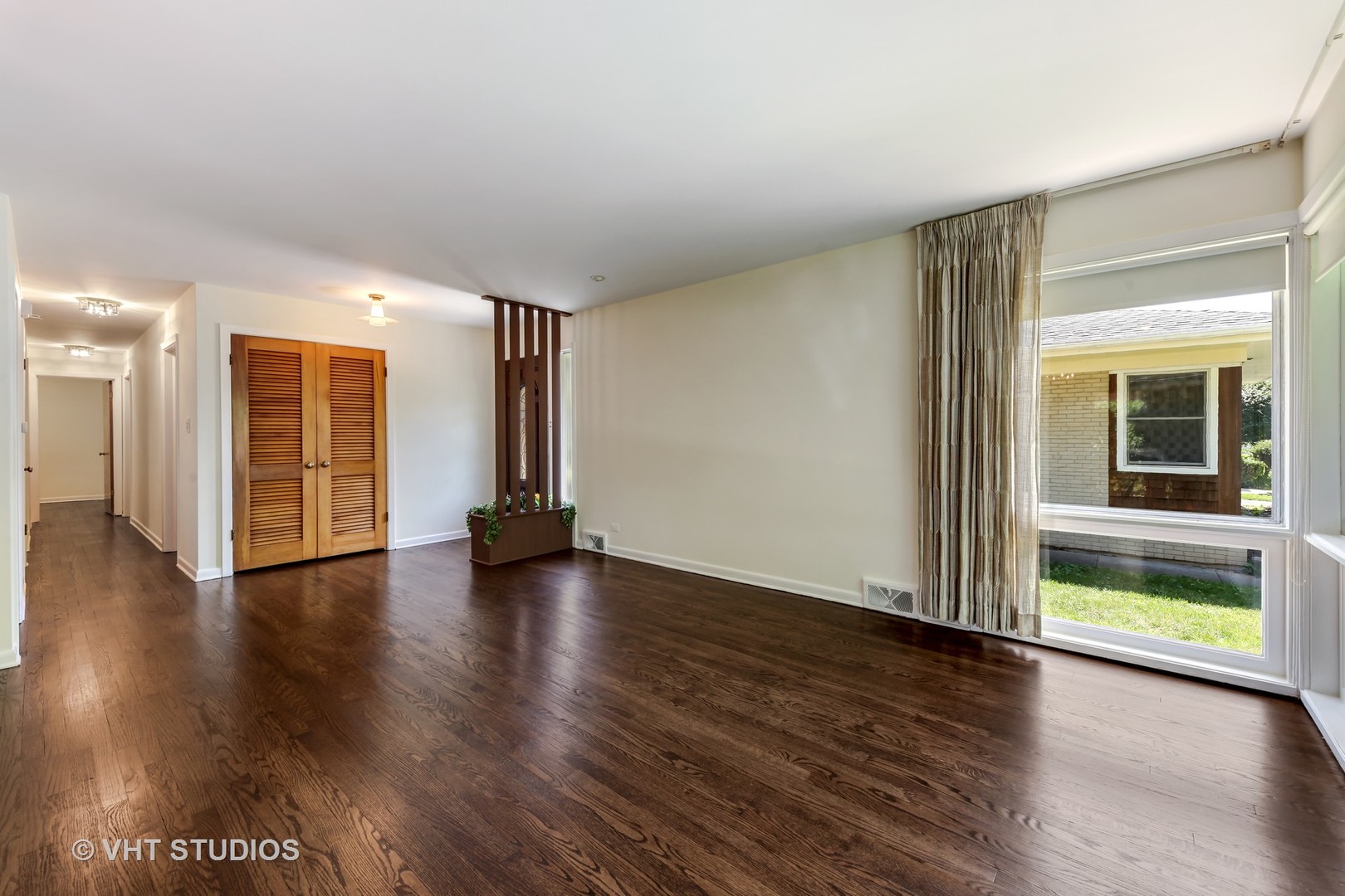 465 Sumac Road Highland Park, IL 60035 - Photo 3 of 19 a view of an empty room with wooden floor and a window