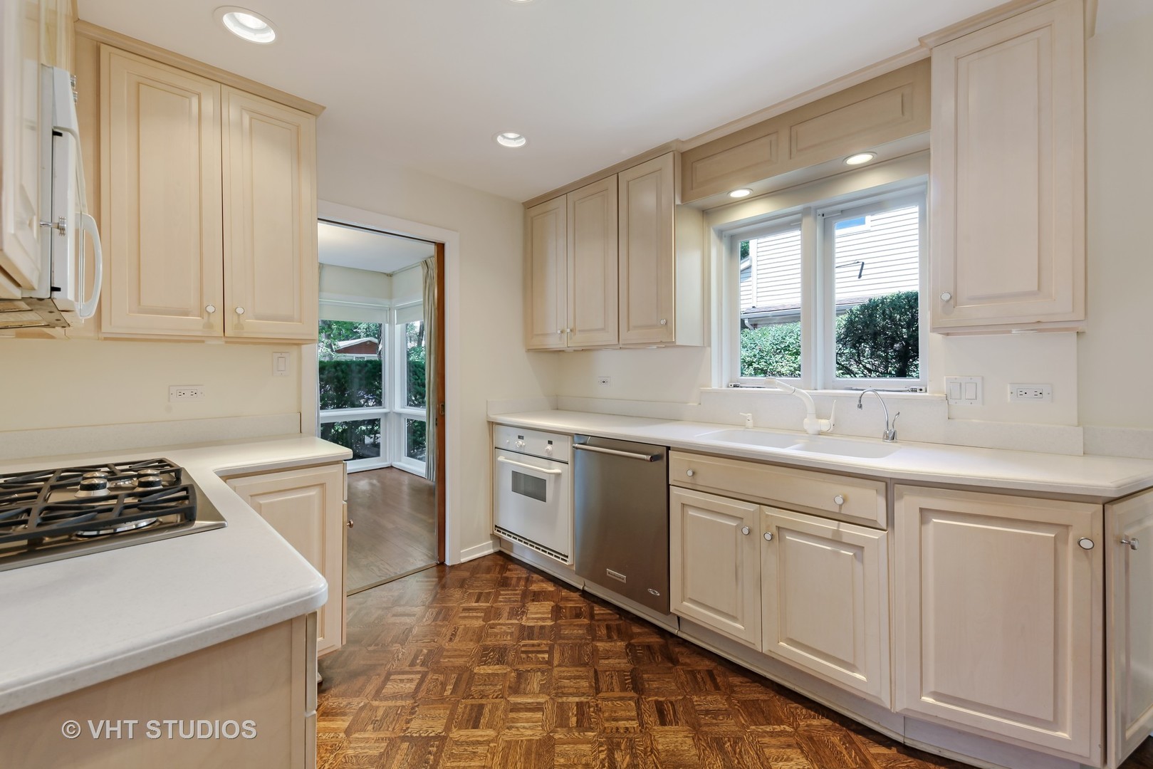 465 Sumac Road Highland Park, IL 60035 - Photo 6 of 19 a kitchen with a sink stove and cabinets