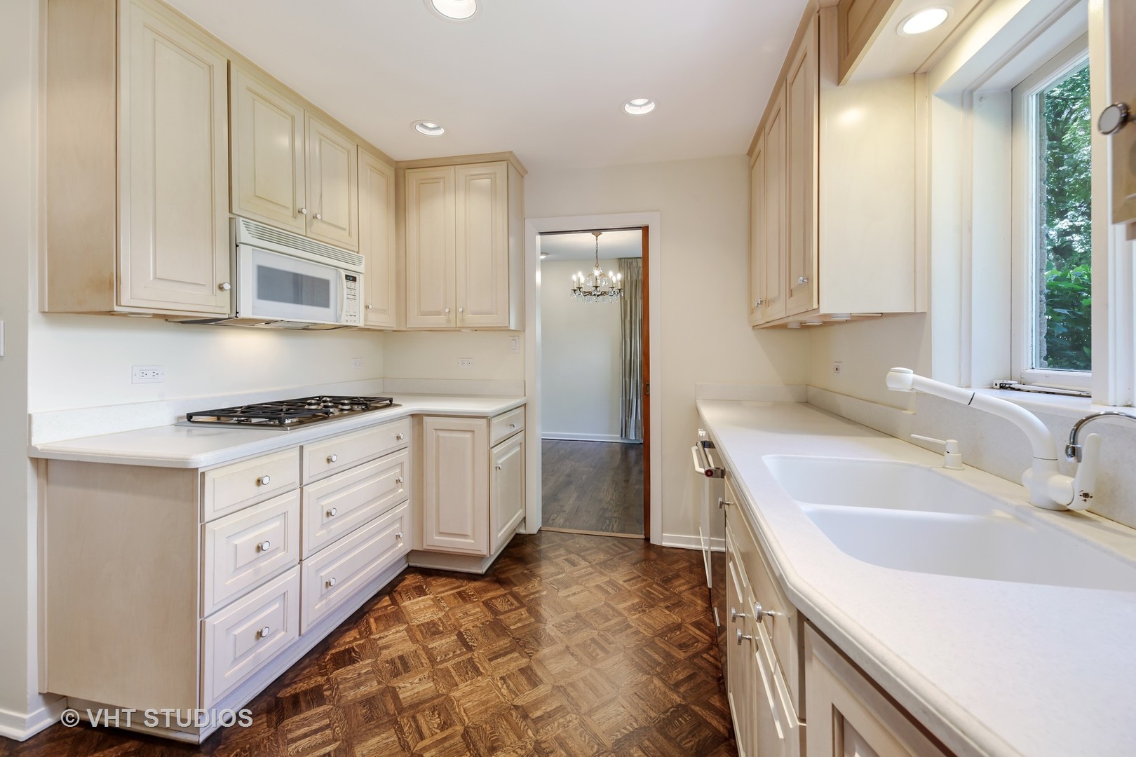 465 Sumac Road Highland Park, IL 60035 - Photo 7 of 19 a kitchen with granite countertop a sink stove and cabinets